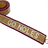 Gold beaded bag strap with garnet edging and white “Go Noles” lettering
