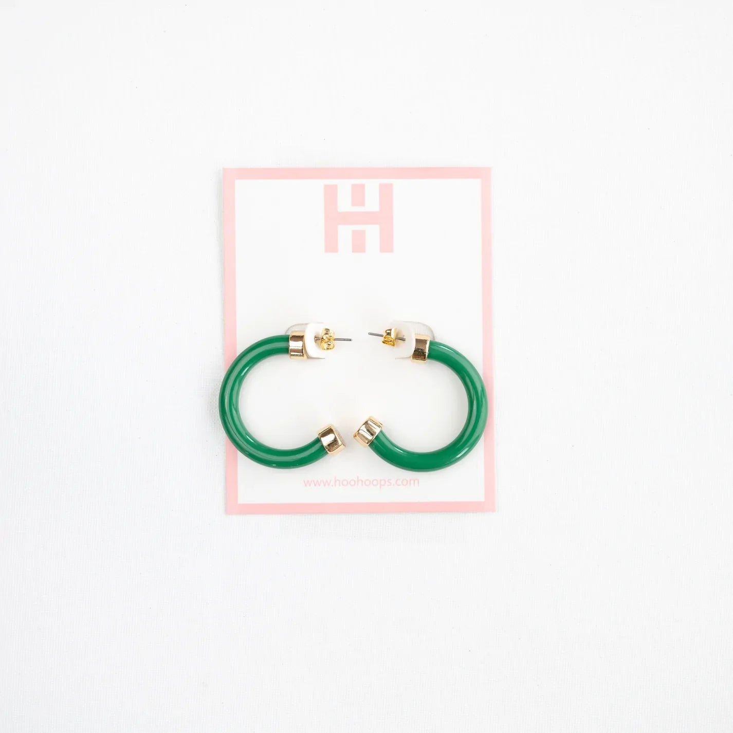 Mini Kelly Green hoop earrings with glossy finish, small and lightweight design