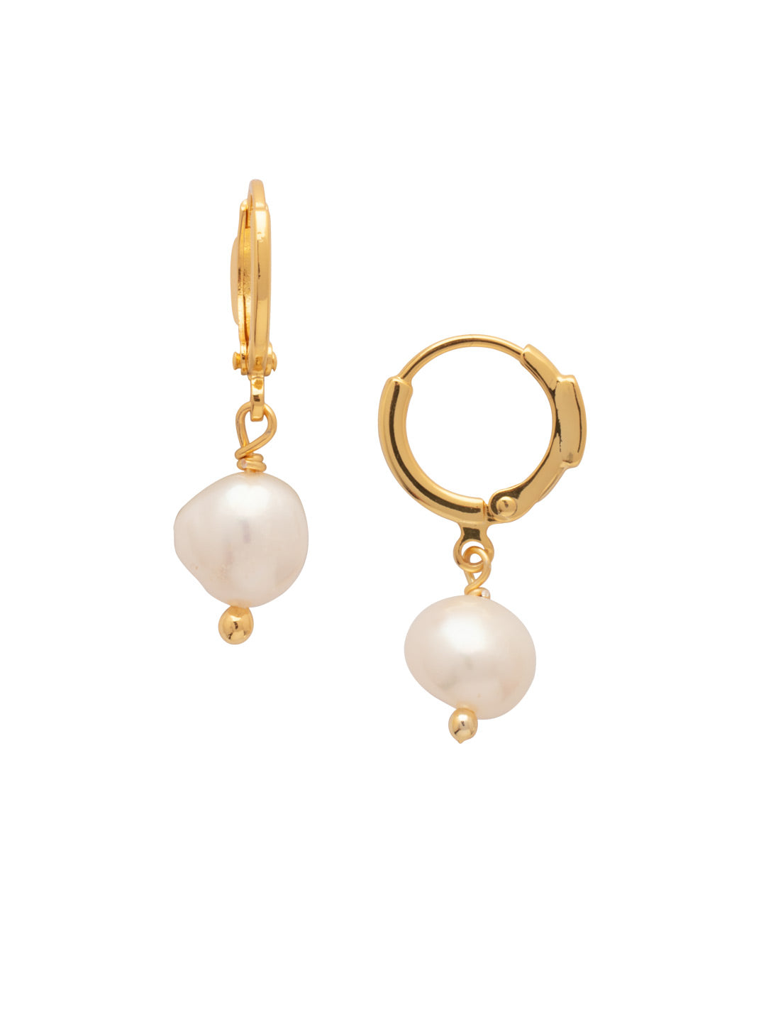 Bright gold-tone huggie hoop earrings with dangling round freshwater pearls from Sorrelli’s Modern Pearl Collection.