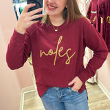 Garnet crewneck sweatshirt with gold braided rope embroidery spelling “Noles” on the front