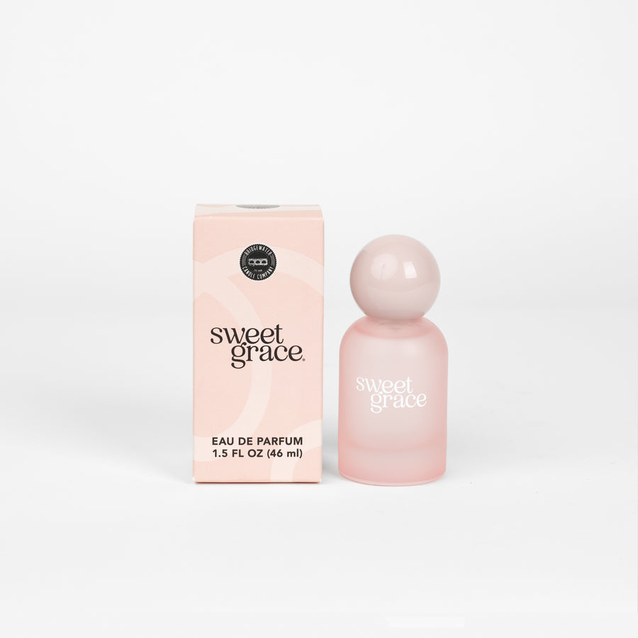 Soft pink perfume bottle styled