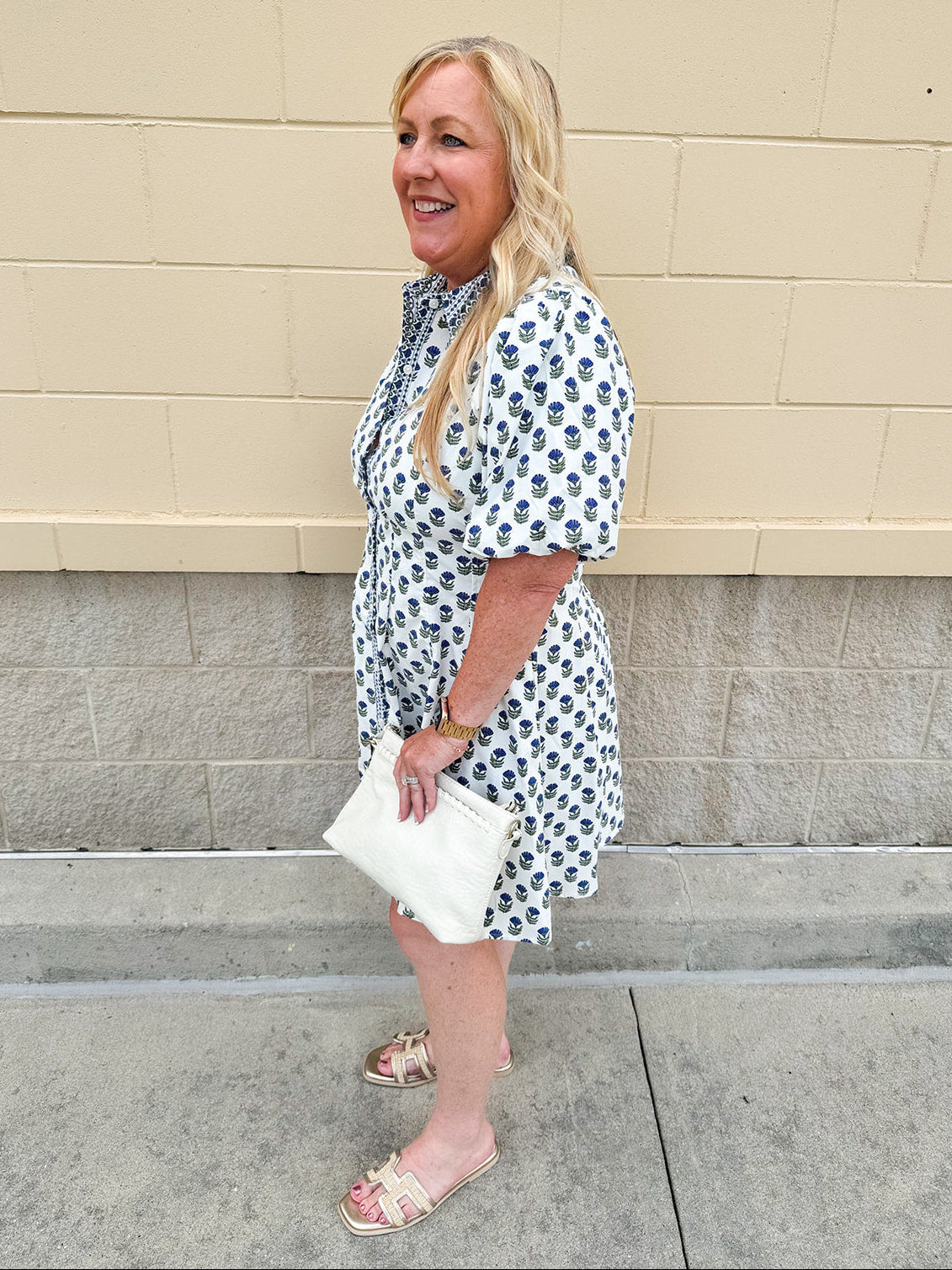 Navy floral dress with puff sleeves, button-down front, and collar