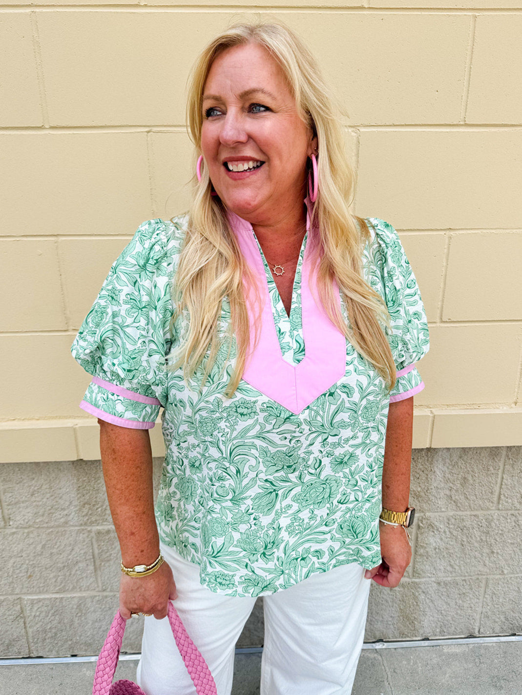 Green floral print caftan-style top with puff sleeves, split neckline, and lightweight fabric for effortless style.