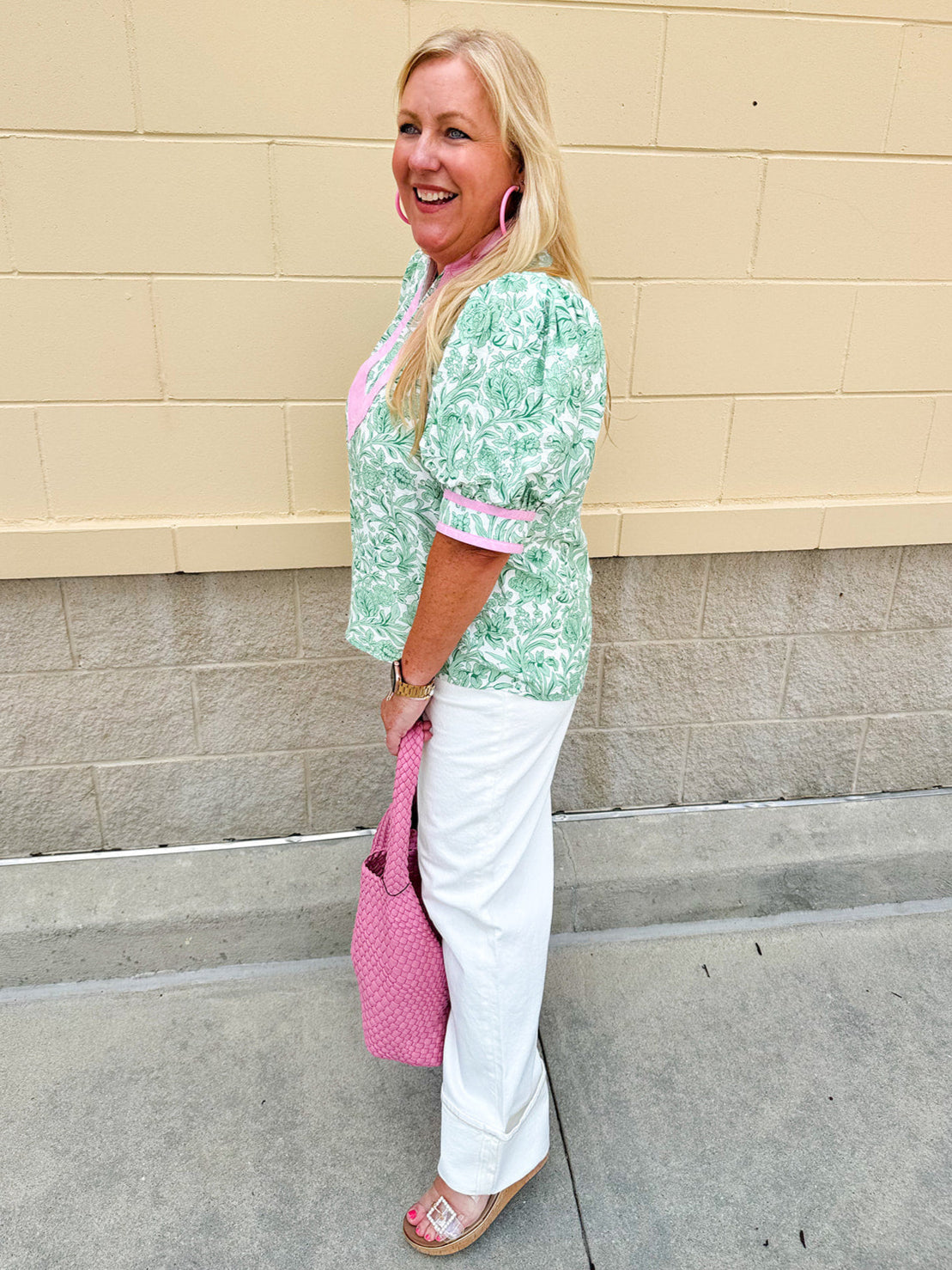 Green floral print caftan-style top with puff sleeves, split neckline, and lightweight fabric for effortless style.