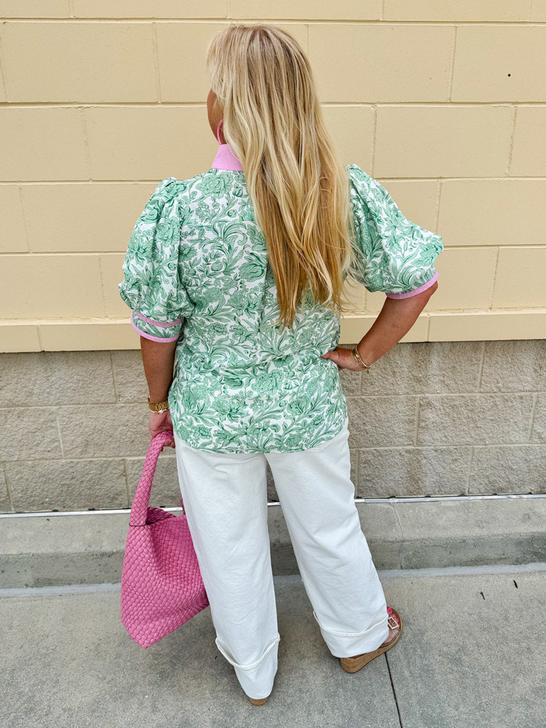 Green floral print caftan-style top with puff sleeves, split neckline, and lightweight fabric for effortless style.