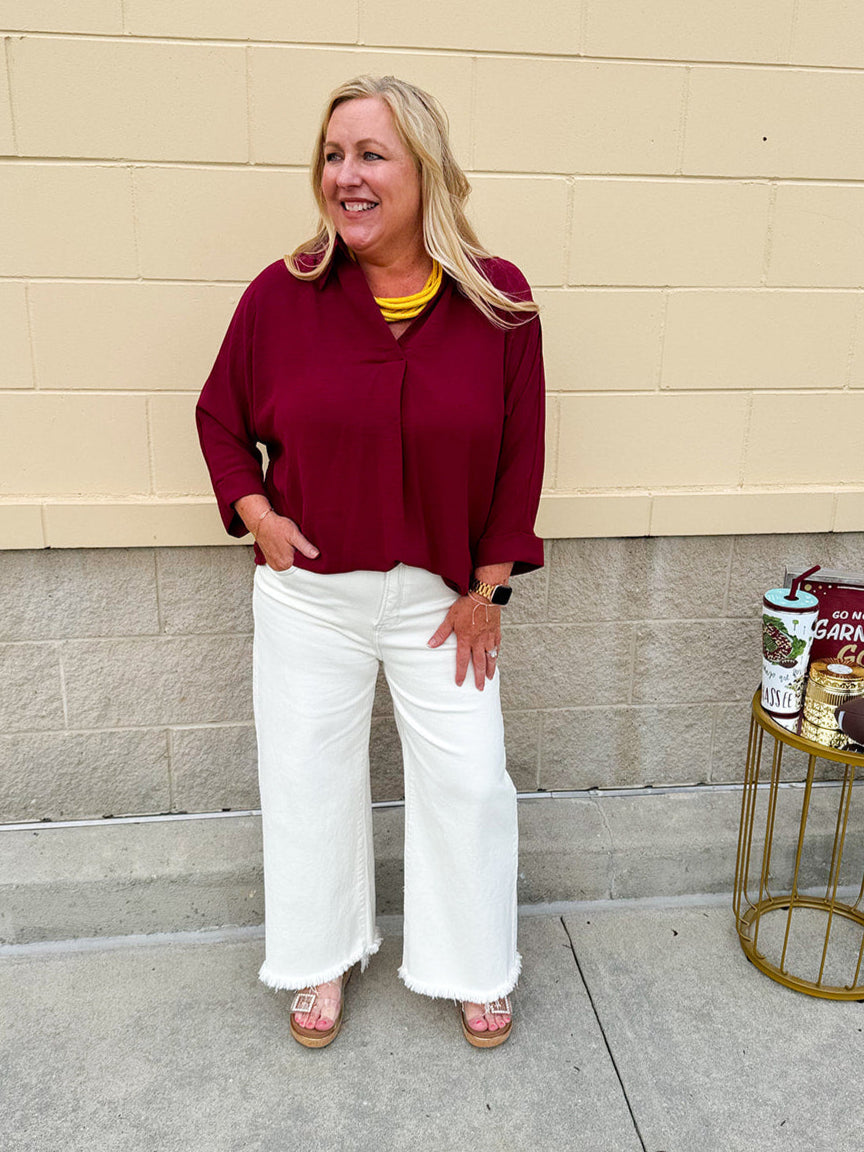 Garnet 3/4 sleeve collared blouse with cuffed sleeves, perfect for game day