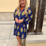 A blue floral mini dress with scalloped collar and 3/4 sleeves styled for fall.