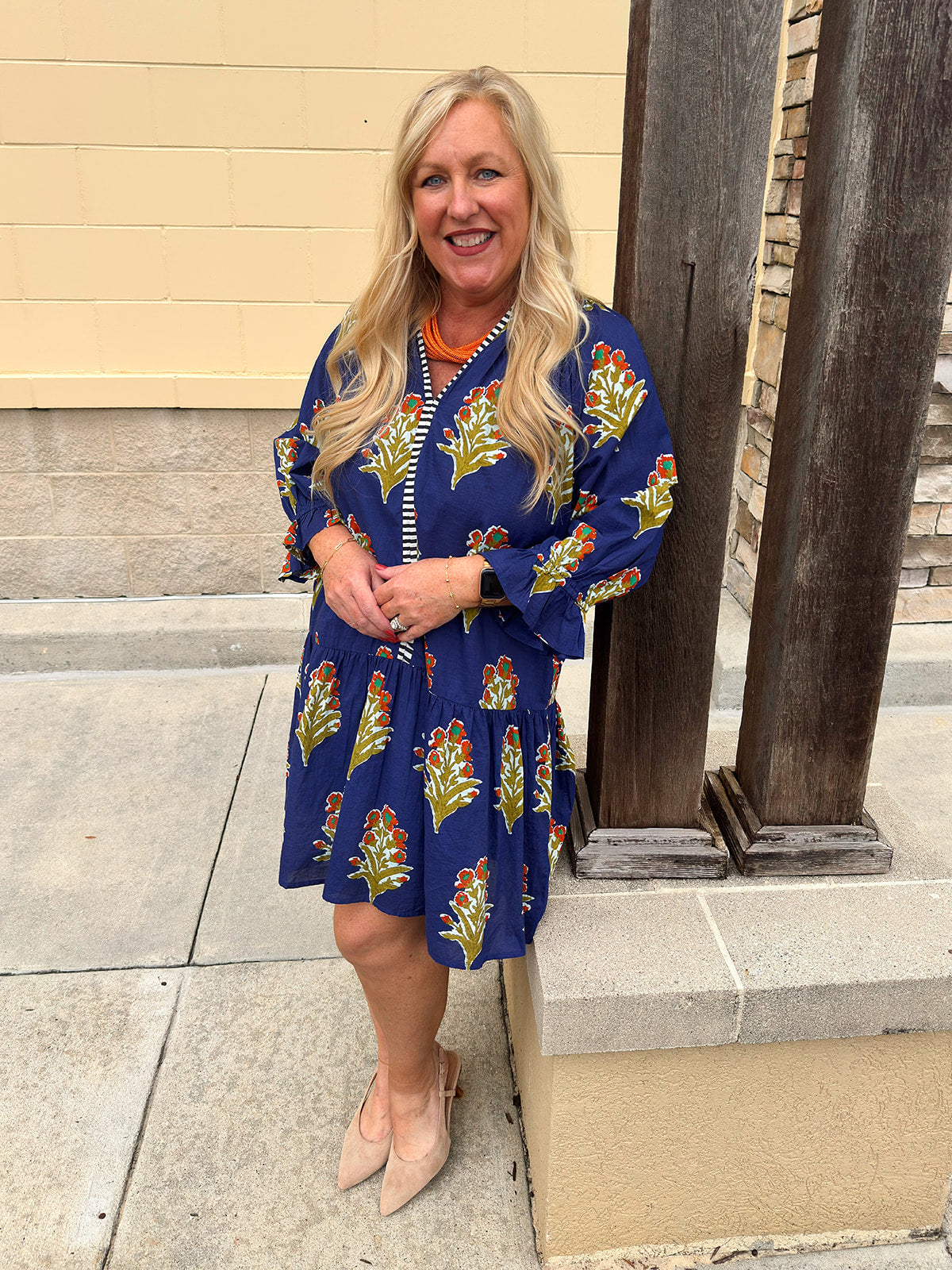 A blue floral mini dress with scalloped collar and 3/4 sleeves styled for fall.