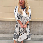 Cream and black abstract print tiered midi dress