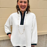 Ecru waffle quarter-zip top with navy and green color block and navy cuffed ¾ sleeves