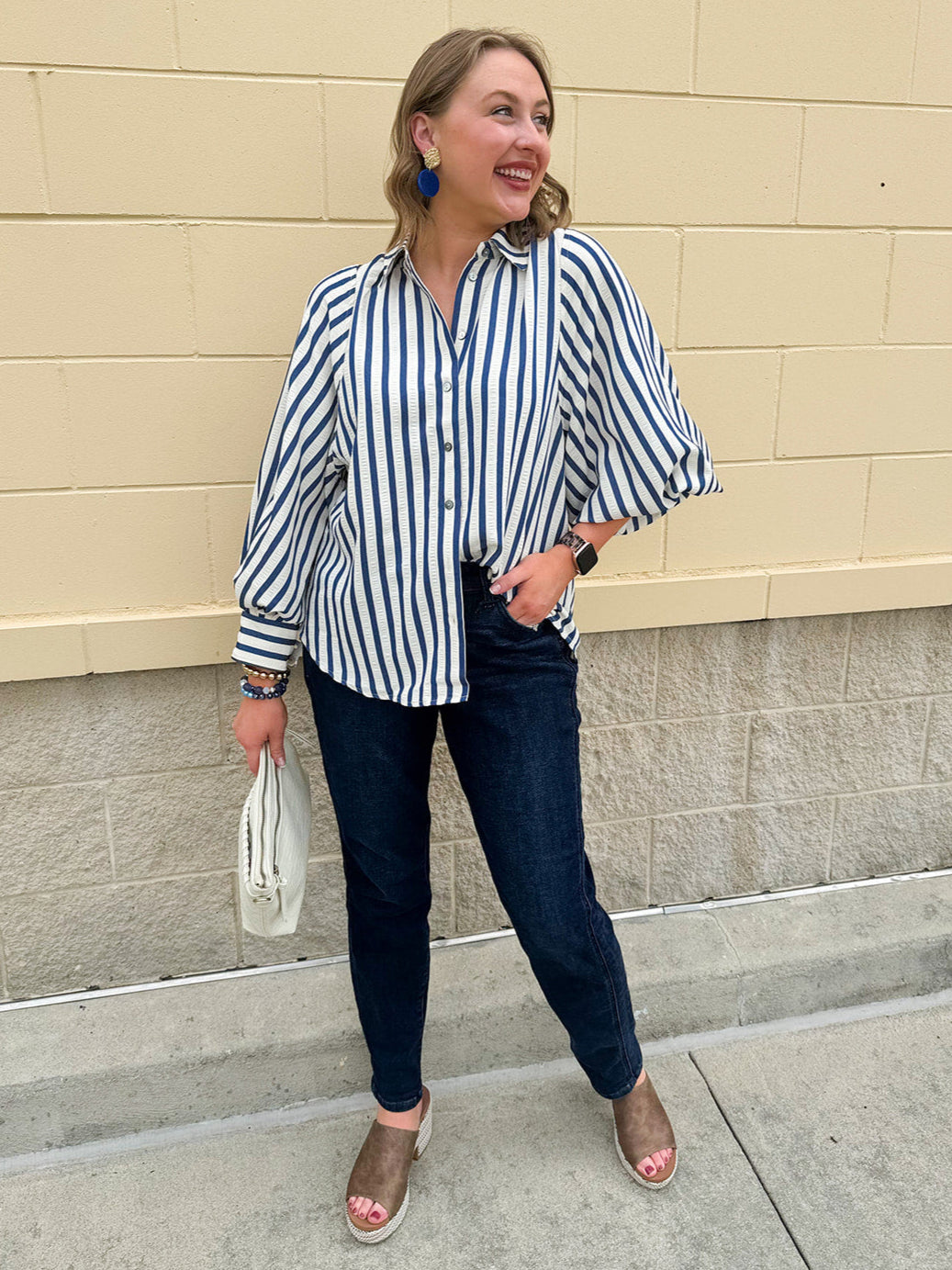 Lightweight striped button-down top in midnight blue and cream with ¾ pirate sleeves, styled for a casual coastal look