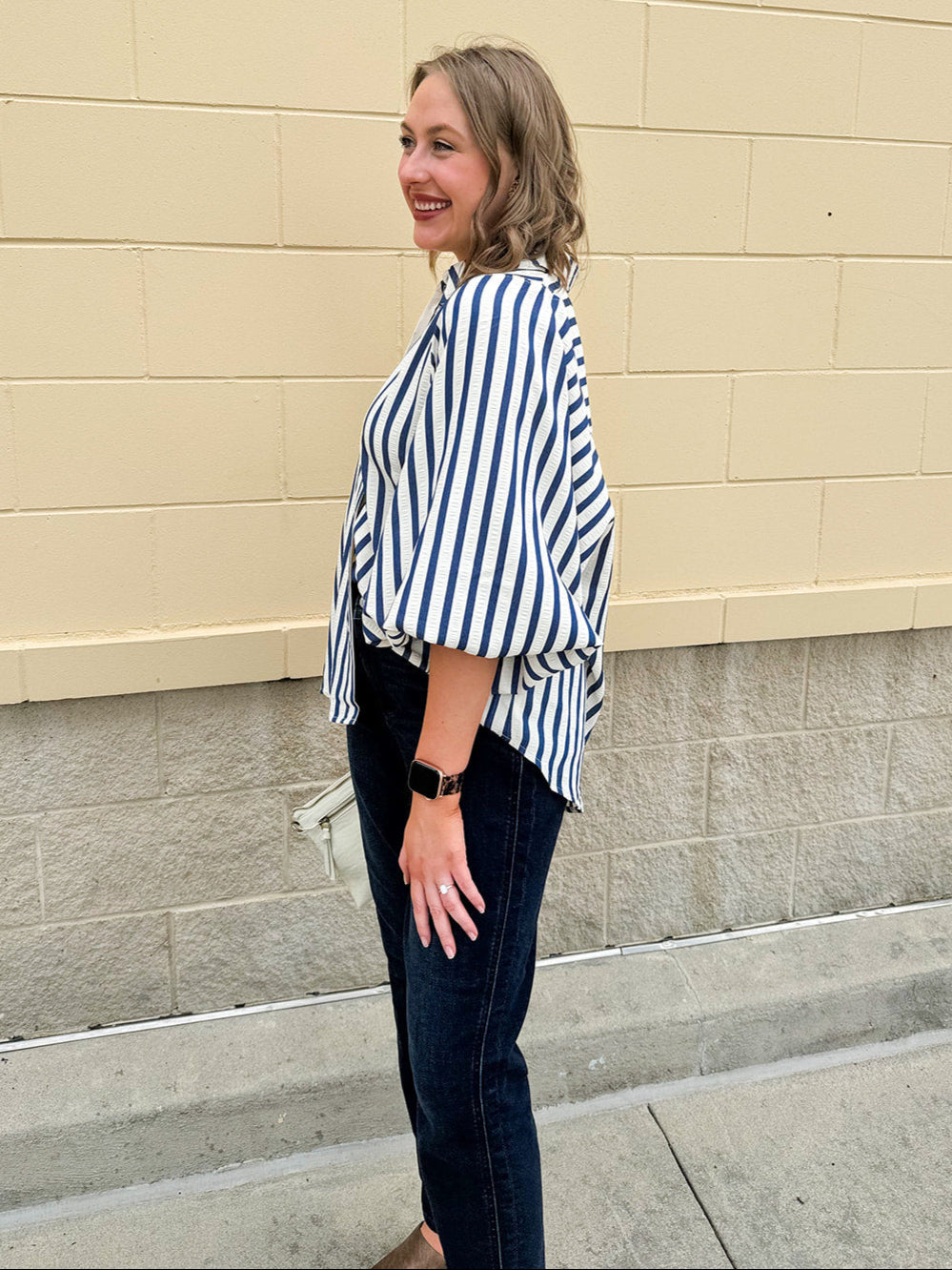 Lightweight striped button-down top in midnight blue and cream with ¾ pirate sleeves, styled for a casual coastal look