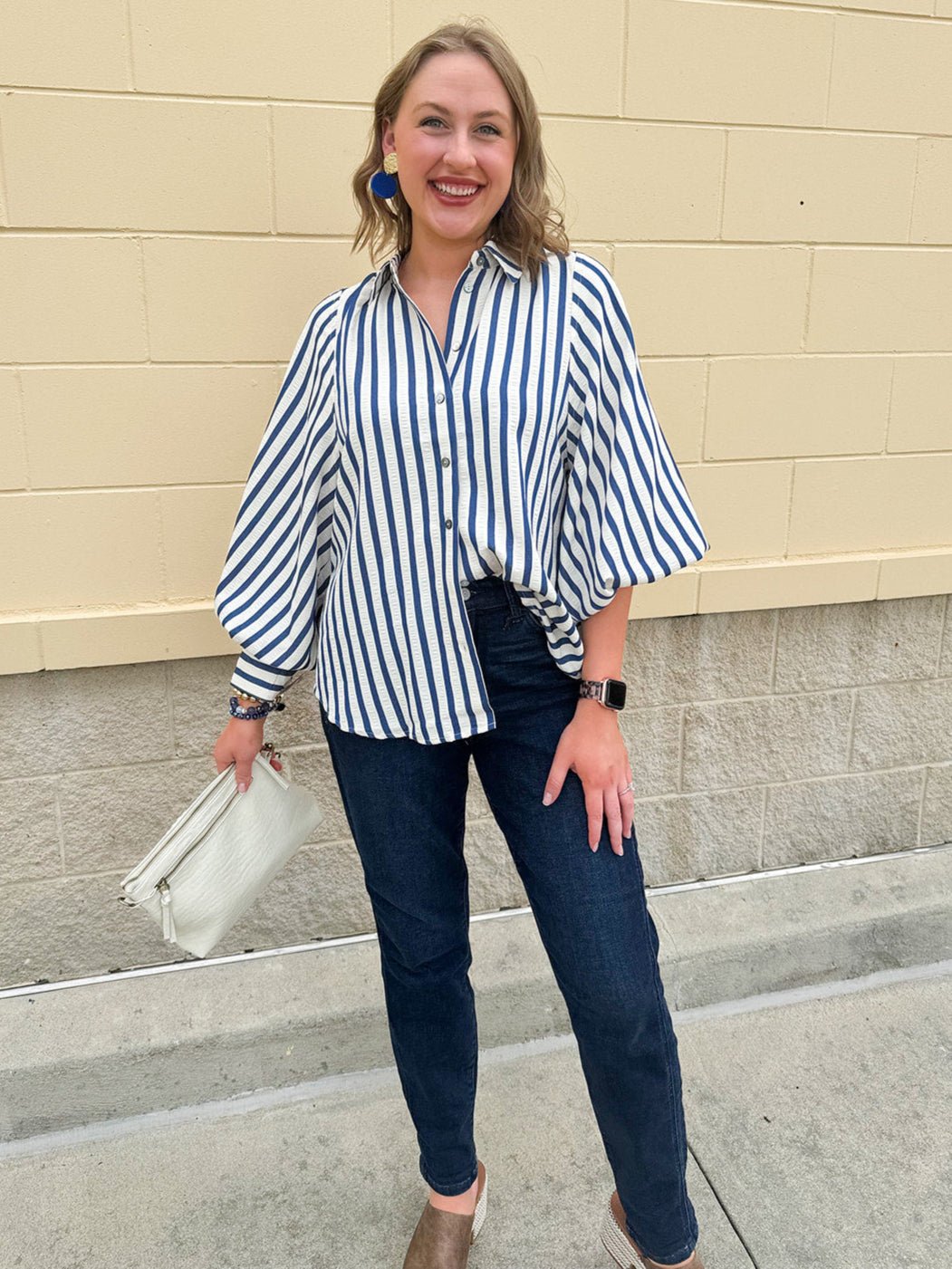 Lightweight striped button-down top in midnight blue and cream with ¾ pirate sleeves, styled for a casual coastal look