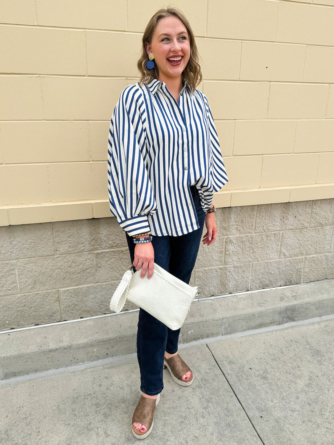 Lightweight striped button-down top in midnight blue and cream with ¾ pirate sleeves, styled for a casual coastal look