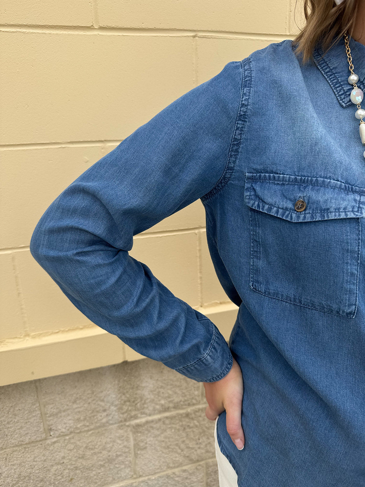 Light chambray button-down shirt with collar and chest pockets