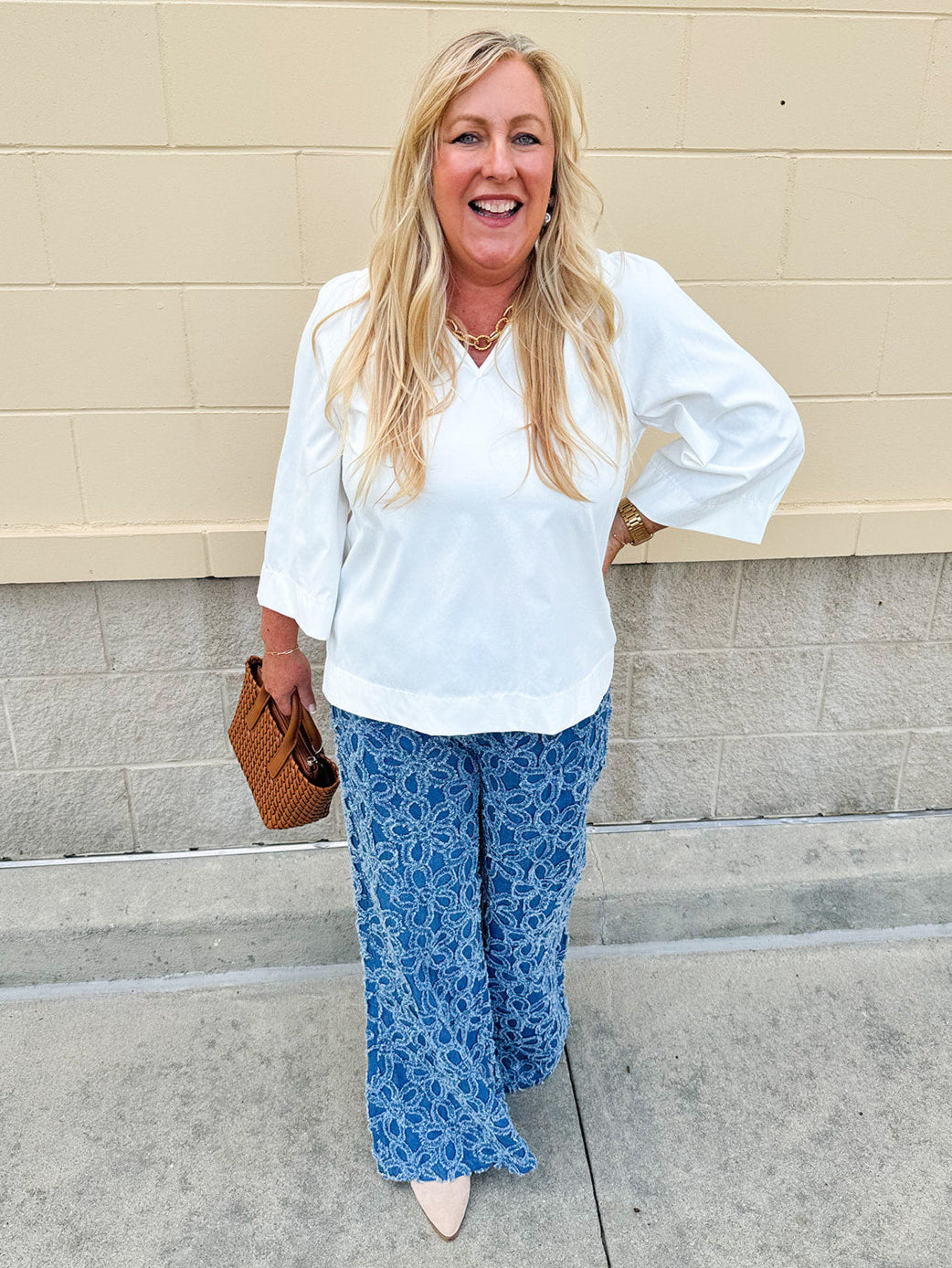 Medium wash wide-leg denim palazzo pants with chenille flower embroidery