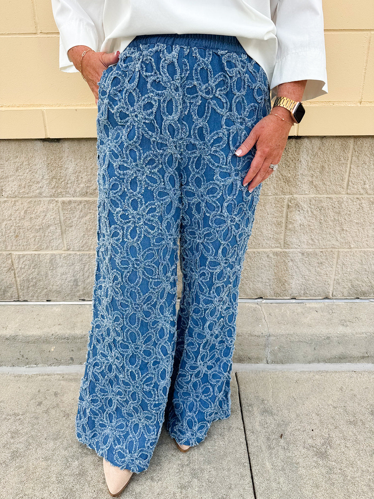 Medium wash wide-leg denim palazzo pants with chenille flower embroidery