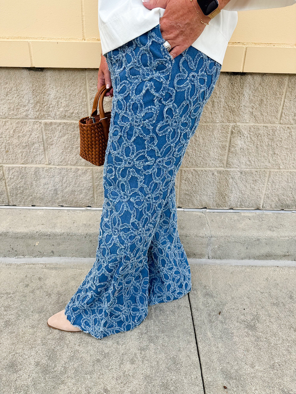 Medium wash wide-leg denim palazzo pants with chenille flower embroidery