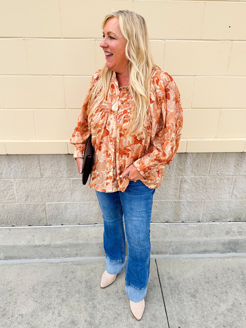 Floral paisley blouse with pleated bib front, balloon sleeves, and a soft standing collar styled for a vintage-inspired look
