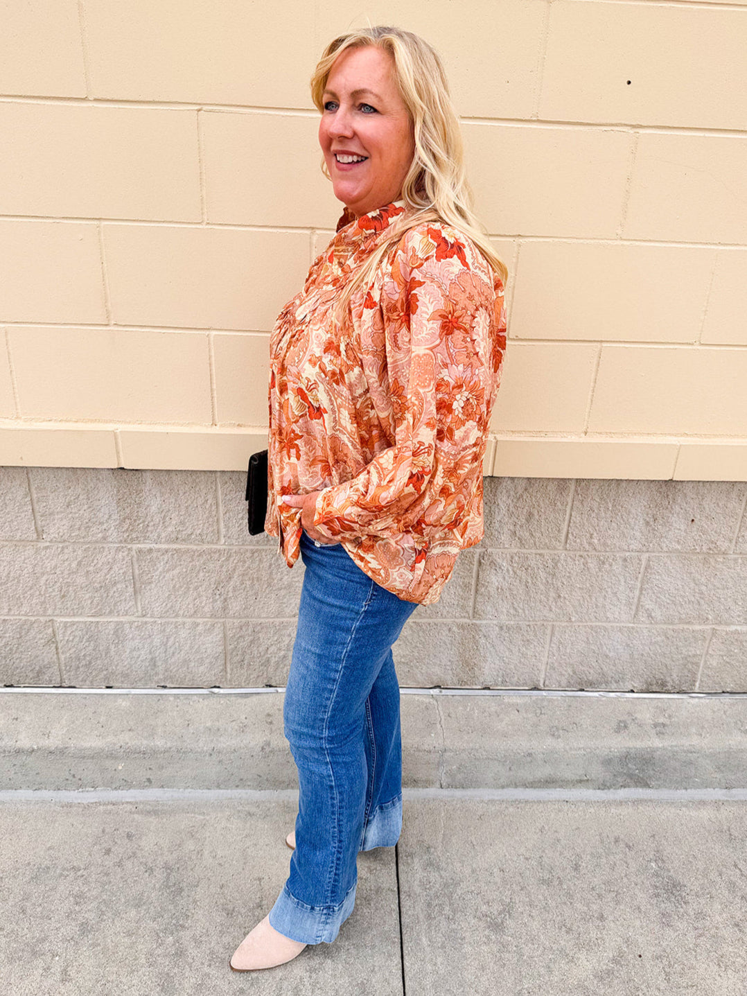 Floral paisley blouse with pleated bib front, balloon sleeves, and a soft standing collar styled for a vintage-inspired look
