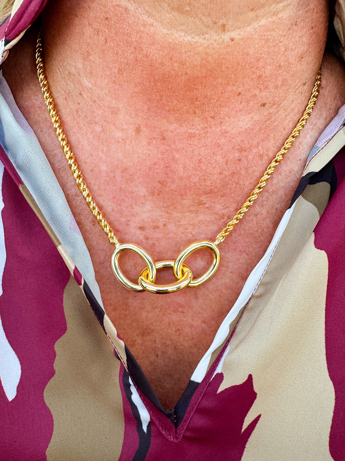 Gold-toned necklace with three statement chain links on a delicate rope chain—elegant, timeless, and made to last.