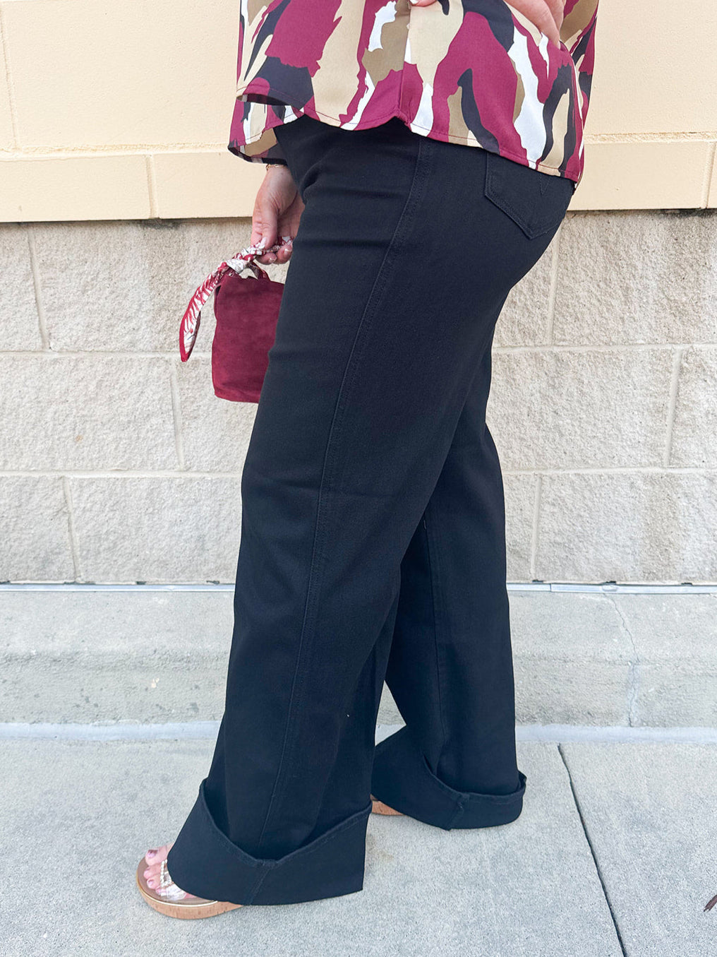 Black high-rise wide-leg jeans with cuffed hems