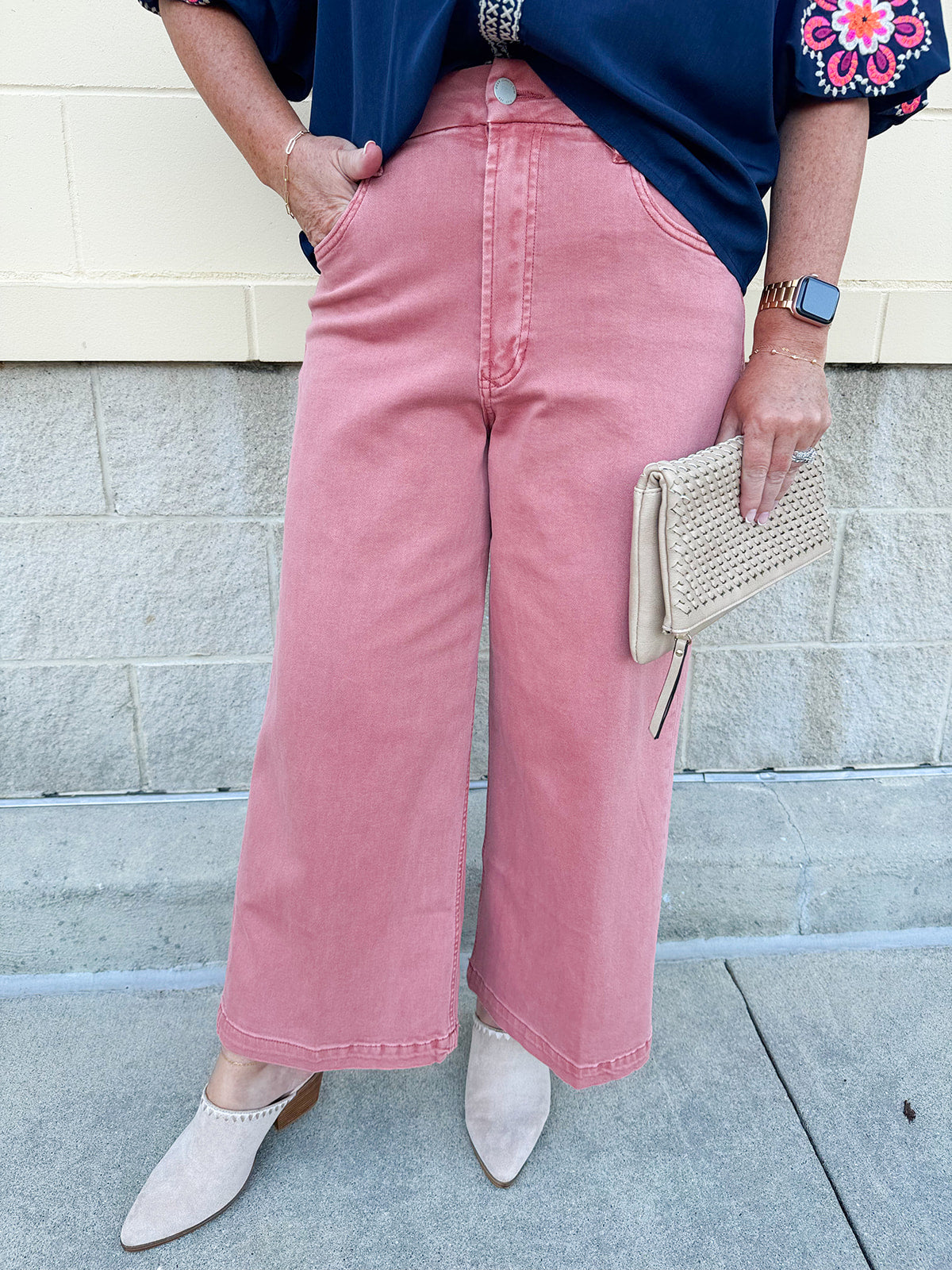 Women’s cropped wide-leg jeans in a terracotta color with a raw cut hem