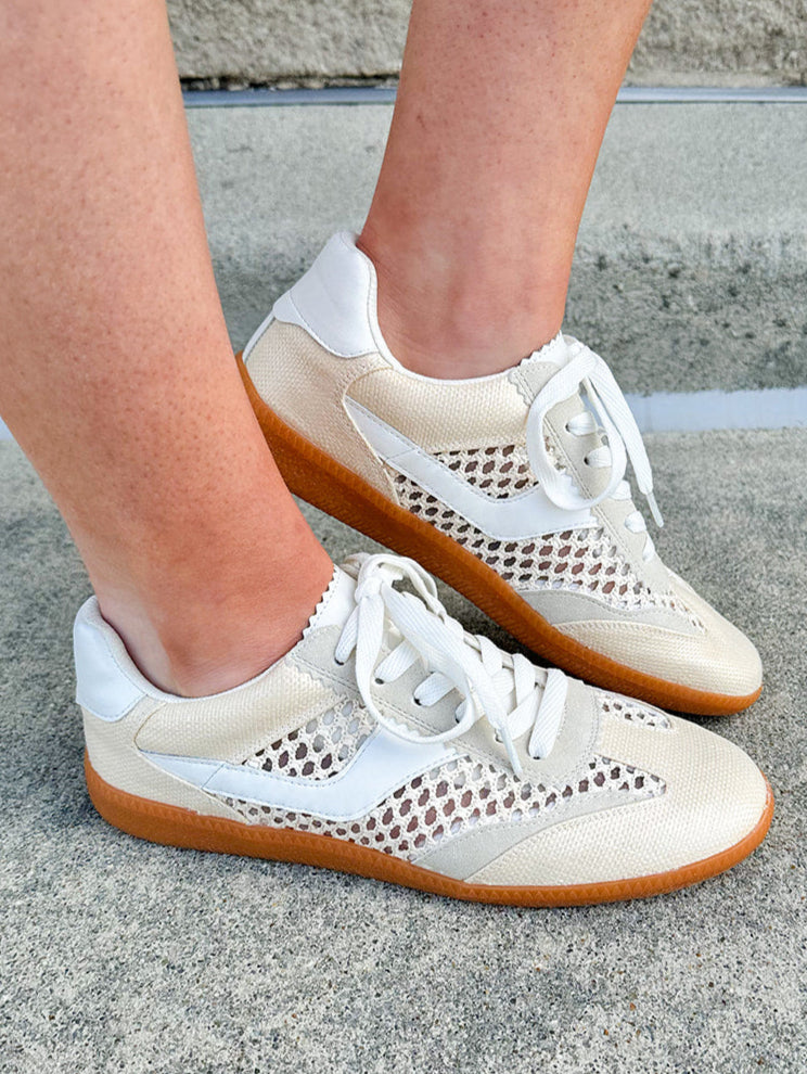 Neutral woven low-top sneakers with muted laces, round toe, and 1-inch heel, styled for casual and fashion-forward everyday looks.