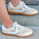 Neutral woven low-top sneakers with muted laces, round toe, and 1-inch heel, styled for casual and fashion-forward everyday looks.