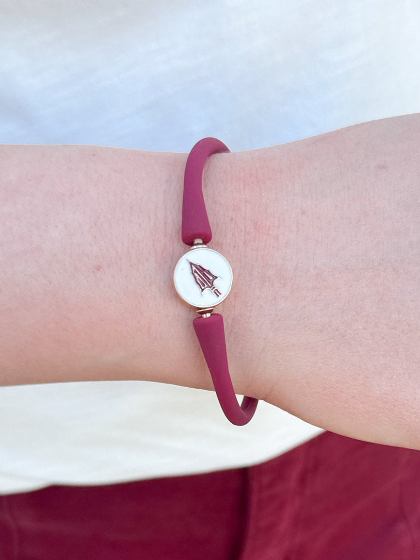 A sleek waterproof silicone bracelet featuring an enamel Florida State University logo charm at the clasp.