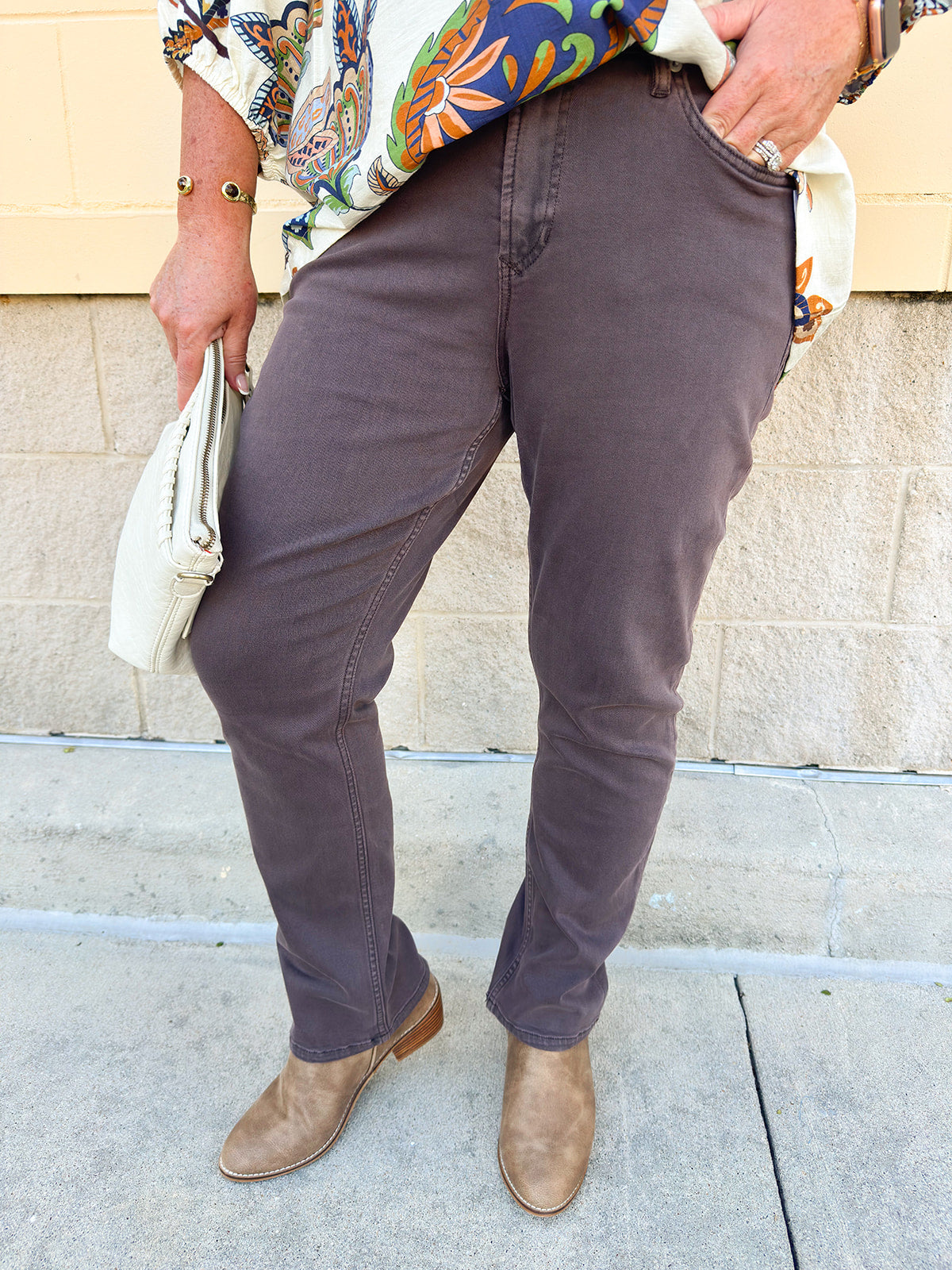 Mocha brown slim straight leg jeans with mid rise and full inseam.