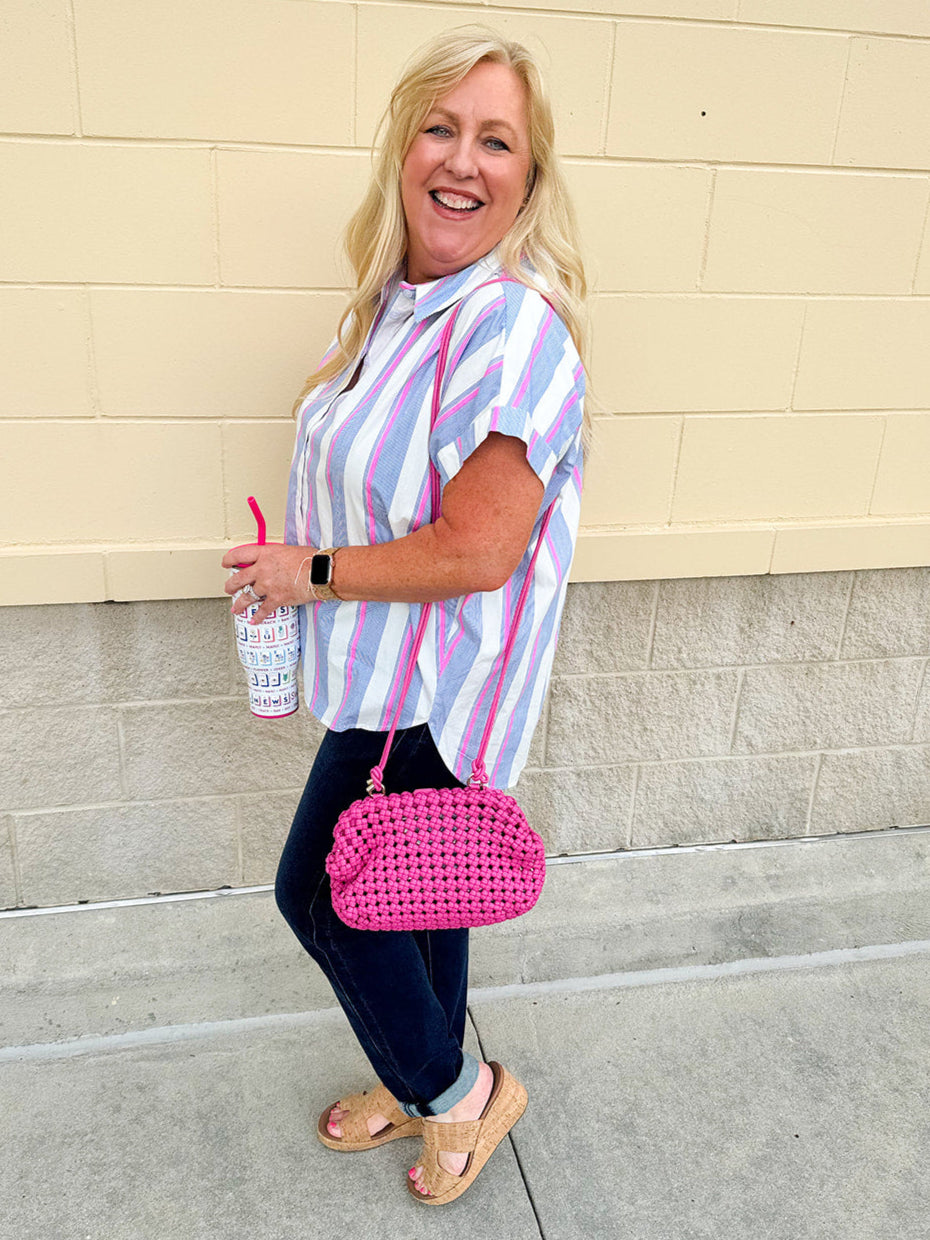 Striped cotton blouse with blue, pink, and white vertical stripes, short dolman sleeves, and button-down front