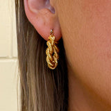 Gold double hoop earrings with twisted rope design and sterling silver posts—medium size, tarnish-resistant and hypoallergenic