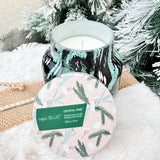 Capri Blue Holiday Pattern Play Crystal Pine Candle in black jar with green and mint fir leaf design.