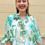 Long oatmeal-colored necklace with mixed circle and bead design, featuring neutral stones and delicate chain