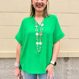 Mini Kelly Green hoop earrings with glossy finish, small and lightweight design