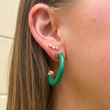 Mini Kelly Green hoop earrings with glossy finish, small and lightweight design