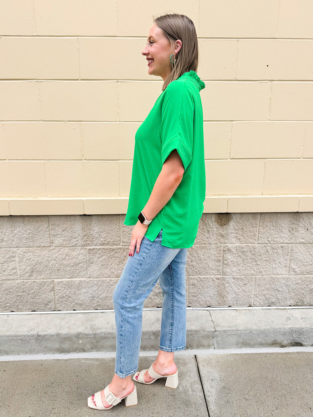 Kelly green blouse with frilled V-neckline, short dolman sleeves, and banded cuffs—bright, stylish, and feminine.