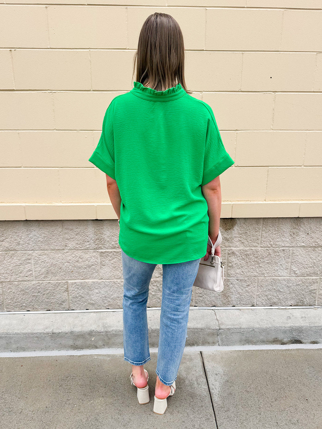 Kelly green blouse with frilled V-neckline, short dolman sleeves, and banded cuffs—bright, stylish, and feminine.