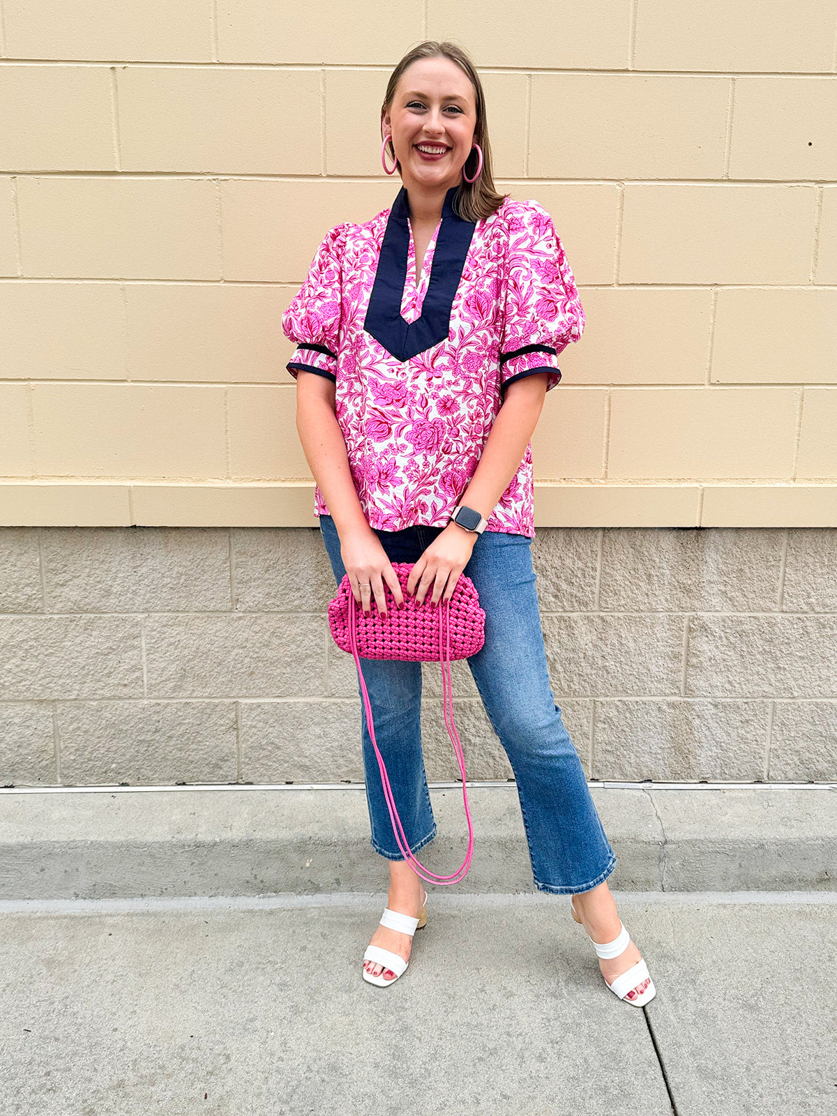 Pink caftan-style top with split neckline and botanical floral print, lightweight and relaxed fit