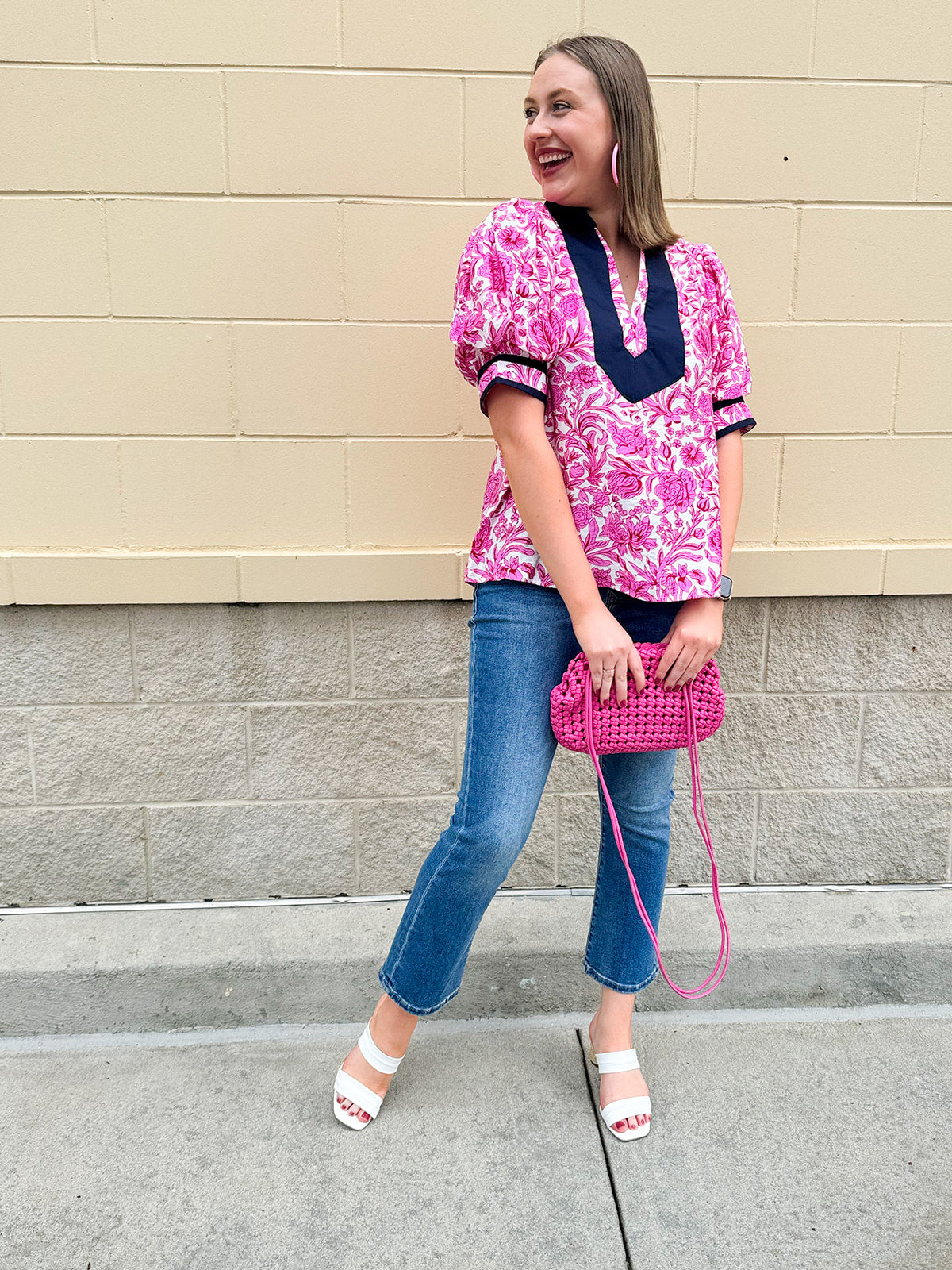 Pink caftan-style top with split neckline and botanical floral print, lightweight and relaxed fit