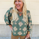 Olive printed V-neck blouse with ¾ puff sleeves and ric-rac trim detailing.