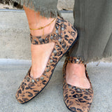 Tan leopard-print studded ankle strap ballerina flats with silver grommets and square toe.
