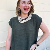 Dark olive oversized short-sleeve crew neck sweater with drop shoulder and side slits.