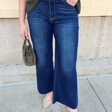 Dark wash cropped wide-leg jeans by Risen with mid-rise fit.