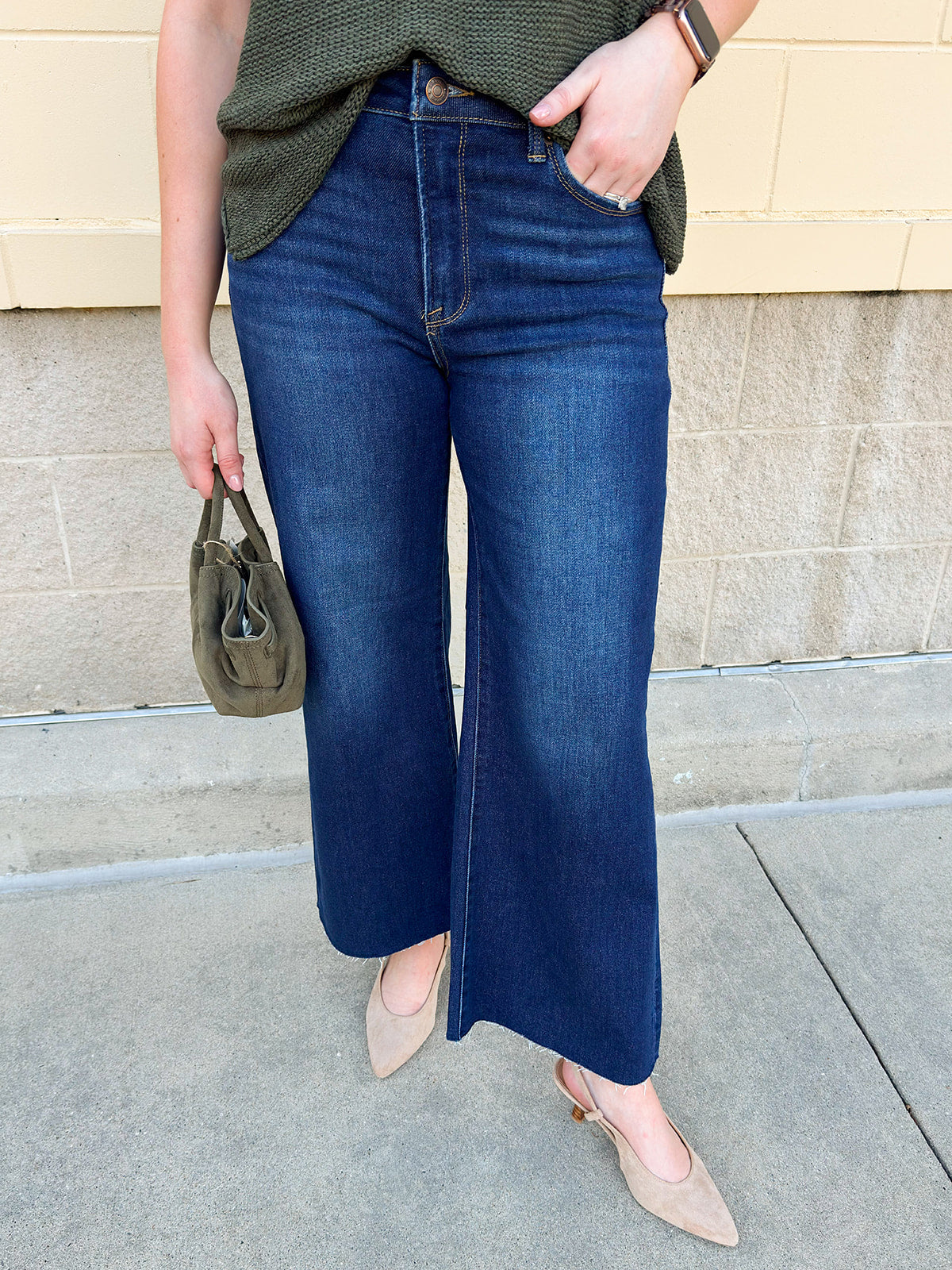 Dark wash cropped wide-leg jeans by Risen with mid-rise fit.