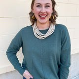 Sage green round neck knit sweater with front seam detail