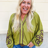 Chartreuse blouse with garnet soutache embroidery, V-neckline, and pirate-style long sleeves with elastic cuffs.