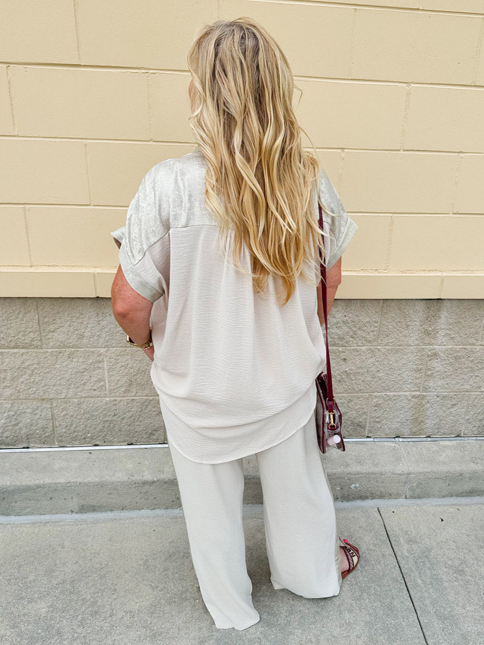 Oatmeal button-down top with gold trim, relaxed fit