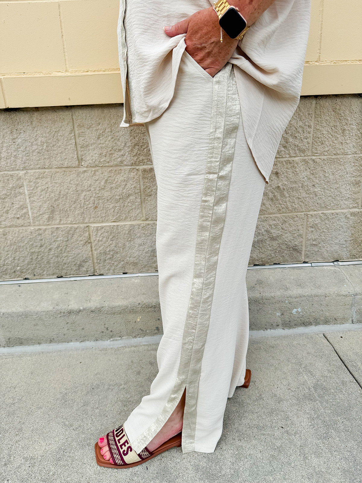 Oatmeal wide leg pants with gold side piping and drawstring waist